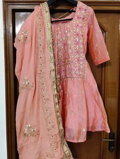 Item Overview ATHARVA Hand Embroidered Anarkali Dress/Peach/All Over Embroidery/Chiffon Gota Patti Dupatta/Customized Stitching/Wedding/Gift AK 5003 Fabric: * Shirt: Chanderi Silk/With Lining/2.5 Mts, with Beautiful All Over Hand Embroidery/Stitched Anarkali Style * Dupatta: Chiffon Chinnon Dupatta 2.5Mts/Hand embroidered Gota Patti Design * Salwar: Dhoti Style/ Santoon Silk 2.5 Mts. Excusive Hand Embroidered Party Wear Punjabi Suit. Customization: * Fabrics Customization: Designs Can be made in Semi-stitched Peach Traditional Wear For Diwali, Diwali Peach Semi-stitched Traditional Wear, Traditional Peach Salwar Kameez For Festive Occasions, Traditional Peach Salwar Kameez For Diwali, Peach Anarkali Dress For Diwali, Peach Anarkali Dress For Festive Occasions, Bollywood Style Peach Traditional Wear For Diwali, Peach Bollywood Traditional Wear For Diwali, Peach Traditional Sharara For Navratri