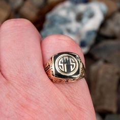 This antique 1927 class ring features a black enamel center with the letters SPS in gold. The ring has a pierced open work floral motif decorating the shoulders and gallery. It is crafted of 10k yellow gold and is currently a size 7.75. There is a small amount of enamel loss in the top right corner of the center but this is difficult to see. Art Deco Black Engraved Jewelry, Black Heirloom Ceremonial Jewelry, Black Heirloom Jewelry For Ceremonial Occasions, Black Heirloom Jewelry For Ceremonial Use, Classic Black Enamel Round Ring, Classic Engraved Enamel Ring, Classic Engraved Enamel Jewelry, Antique Yellow Gold Signet Ring With Black Enamel, Antique Engraved Enamel Ring For Formal Occasions