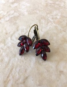 Gorgeous sparkling leaf earrings featuring vintage garnet crystals. Earrings are 1 inch long, 17mm wide. Lever back earring closure for pierced ears. Elegant Burgundy Earrings For Formal Occasions, Garnet Dangle Jewelry For Weddings, Garnet Dangle Earrings For Wedding, Wedding Dangle Garnet Jewelry, Wedding Garnet Dangle Jewelry, Elegant Burgundy Dangle Jewelry, Vintage Ruby Earrings For Wedding, Mauve Earrings, Diamond Star Earrings