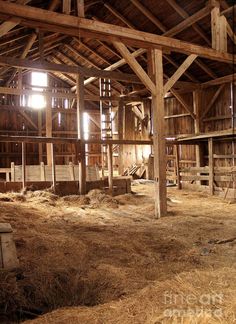 the inside of an old barn with hay