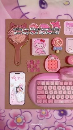 there is a keyboard, mouse and other items on this table top with hello kitty theme