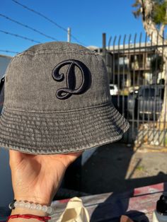 A stylish black Dodgers bucket hat, perfect for sunny days at the ballpark or casual outings, featuring the iconic Dodgers logo embroidered in black, offering both shade and classic flair. Dodgers Logo, Loft Ideas, Bucket Hats, Logo Embroidered, Sunny Days, All Black, Caps Hats, Bucket Hat, Accessories Hats