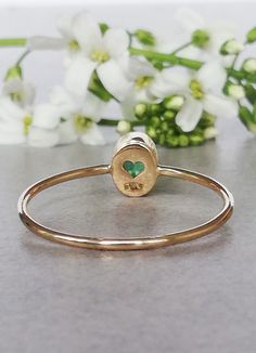 Beautiful, classic, delicate oval Emerald Ring in 14k Yellow Gold, Emerald Engagement Ring. CENTRAL STONE: *natural, Earth mined emerald *shape: oval *The emerald is bezel set and the mounting around the stone is hammered *Emerald with setting measures approximately: 5.8mm X 4.9mm SPECIFICATIONS: *band: approximately 1 mm * material: 14k yellow gold, Eco friendly, recycled (this ring is also available in 14k rose or white gold, for 18k please inquire about the price) * size: this ring is availab Heart-shaped Ring For May Birthstone Gift, Heart-shaped May Birthstone Ring For Gift, Heart Cut Emerald Ring For May Birthstone, Oval Gemstone Heart Ring As Gift, Oval Gemstone Heart Ring For Gifts, May Birthstone Heart Ring Gift, Green Heart Ring For May Birthstone Gift, Handmade 14k Gold Emerald Ring For Anniversary, Oval Heart Birthstone Ring Fine Jewelry