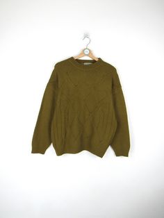 Vintage 90s sweater, green color 70% Wool - 30% Acrylic Made in Italy Size M Measures Shoulder width: 58 cm Sleeve length: 53cm Chest width: 56 cm Length: 66cm Condition: EXCELLENT - Shows signs of wear over time Our garments are all vintage and second hand. Any signs of wear or defects are documented with photos and description. For any questions, photos, videos we are at your disposal.🌈 Green Knit Sweater With Crew Neck, Green Crew Neck Sweater For Winter, Green Knit Crew Neck Sweater, Olive Crew Neck Sweater For Fall, Olive Knit Long Sleeve Sweater, Vintage Green Oversized Sweater, Green Oversized Retro Sweater, Retro Green Winter Sweater, Olive Crew Neck Top For Winter