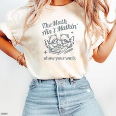 "The Math Ain't Mathin'" - Comfort Colors T-Shirt Get ready to make a statement in the classroom with this adorable Math Teacher Shirt! Perfect for the coffee-loving math enthusiast, this cute back to school tee is a must-have for any math teacher. Show some love and appreciation with this Teacher Appreciation T-Shirt, designed for the true math lover in your life. Makes a thoughtful and fun gift for a new teacher who can't resist a good cup of coffee! The Math Ain't Mathin' Math Teacher Shirt, Teacher Things Shirt Math, Teacher Gift T-shirt, Cute Teacher Shirts Math, Teaching Shirts Ideas, Funny Math Teacher Shirts, Teacher Cricut Ideas, Math Teacher Outfits, Funny Teacher Tshirts, Math Tshirt