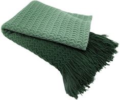 a green blanket laying on top of a white background