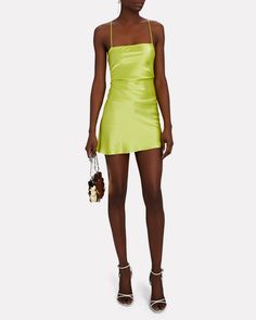 Cut from vivid green silk charmeuse the label's Suna mini dress channels '90s minimalism with a slip silhouette that reveals a sultry lace-up back.   Fabric: 100% silk.   Lace-up back closure.   Imported.       Length from shoulder to hem: 35".   Model is wearing size P.  Model height 5'10", bust 30", waist 23", hips 33". Spring Mini Dress With Boning, Chic Spring Mini Dress With Boning, Spring Cocktail Slip Dress With Square Neck, Mini Satin Evening Dress For Summer, Mini Satin Summer Evening Dress, Green Square Neck Mini Dress For Party, Green Mini Dress With Square Neck For Party, Fitted Satin Square Neck Dress For Spring, Fitted Satin Spring Dress With Square Neck