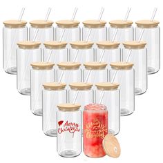 twelve clear glass jars with wooden lids, each filled with different types of christmas candy