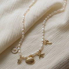 How charming! Channel your beach vibes with the Coastal Keepsake Signature Necklace. Featuring coastal charms and summer pearls, this freshwater pearl necklace is the perfect accessory for any sunny day. Bring a touch of the coast wherever you go, and layer it with your favorite Océanne necklace. Genuine Pearls 17" with 2" extender French Collection, Signature Necklace, Bar Jewelry, Forever Jewelry, Freshwater Pearl Necklace, Beach Vibes, Freshwater Pearl Necklaces, Bridal Shop, Beach Vibe