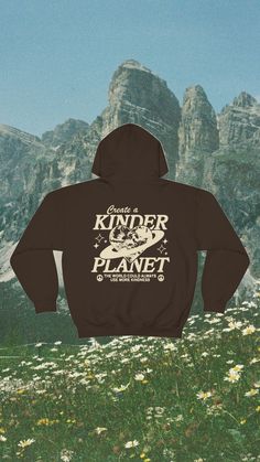 a black hoodie with the words kinder planet on it in front of some mountains