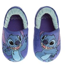 Embrace the mischievous charm of Stitch with these adorable dual-size slippers, perfect for growing toddlers and energetic kids! Slip them on effortlessly with the convenient slip-on closure, and let their feet bask in the soft embrace of cozy nylex fabric. The padded soles offer plush comfort for every hop, skip, and jump, ensuring their playful explorations around the house are always warm and cushioned. Watch their faces light up with the playful Stitch design, transforming playtime into an intergalactic adventure! Stitch Slippers, Stitch Plush, House Shoes Slippers, Light Blue Shoes, Disney Baby Clothes, Toddler Girl Gifts, Disney Shoes, Disney Colors, Toddler Girl Shoes