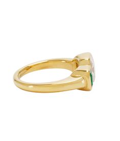 The Kam Ring is a gold-tone ring with multicolor crystal. Featuring a cubic zirconia and emerald stone. Perfect worn alone or with your other Bracha pieces. Water/tarnish resistant Gold Cubic Zirconia Crystal Birthstone Ring, Gold Crystal Birthstone Ring With Cubic Zirconia, Green Gemstone Ring Gold-plated, Green Gemstone Gold Plated Rings, Gold Multi-stone Emerald Cut Sapphire Ring, Gold Emerald Cut Cubic Zirconia Birthstone Ring, Gold Emerald Birthstone Promise Ring, Gold Emerald-cut Cubic Zirconia Birthstone Ring, Gold Emerald Cut Crystal Birthstone Ring