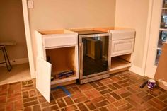 an empty kitchen is being remodeled with new cabinets and appliances in place for the oven to be installed