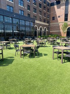 tables and chairs are set out on the grass