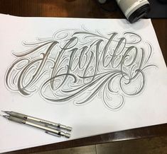 an artistically designed piece of paper with the word ability written in cursive writing