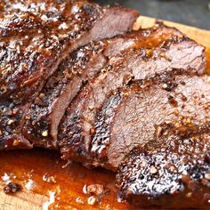 some meat is sitting on a cutting board