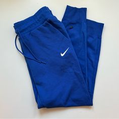 Never Worn! Nike Track Pants Blue, Casual Blue Nike Joggers, Blue Sporty Sweatpants For Spring, Nike Blue Sweatpants For Loungewear, Nike Blue Athleisure Pants, Blue Cotton Sportswear Pants, Fitted Blue Joggers With Pockets, Blue Athleisure Pants With Pockets, Blue Athleisure Pants For Loungewear