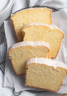 slices of lemon pound cake with icing on a plate