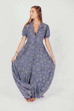 This gorgeous, feminine maxi is the easiest thing to wear for summer holidays and backyard barbeques. We love its lightweight ease and elegant floral pattern, and its front button placket gives it a classic quality you'll love wearing year after year. Available in two colorways. FIT: Runs true to size. MATERIAL: Viscose. GARMENT DETAILS: Lightweight floral maxi dress with a full front button placket, collared V-neckline, and short sleeves. Features a pleated front, in-seam pockets, and lining. S Spring Beach Button-up Maxi Dress, Summer Button-up Maxi Dress For Beach, Summer Button-up Maxi Dress, Summer Beach Maxi Dress With Buttons, Summer Vacation Button-up Maxi Dress, Summer Maxi Dress With Buttons, Summer Beach Maxi Dress With Button Closure, Chic Button-up Maxi Dress For Beach, Summer Maxi Dress With Buttons For Daywear