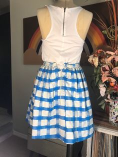 "Turquoise and white heavy cotton weave. Fully lined and gathered at the waist. No label but made well. Measurements: 24\" waist 52\" hips flared skirt 72\" hem circumference 18-1/2\" from bottom of waistband to hem (2) 6-1/2\"x6-1/2\" front pockets 10\" back nylon zipper 3\" surplus hem" Cotton A-line Gathered Skirt, Cotton A-line Bottoms For Day Out, Blue A-line Cotton Bottoms, Blue Cotton Dress With Ruffled Skirt, Fitted Flared Skirt With Gathered Waist, Blue Cotton Dress With Gathered Waist, Cotton Flared Skirt With Gathered Waist, Cotton Skirt With Gathered Waist For Daywear, Cotton Gathered Skirt For Day Out