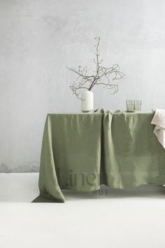 the table is covered with a green cloth