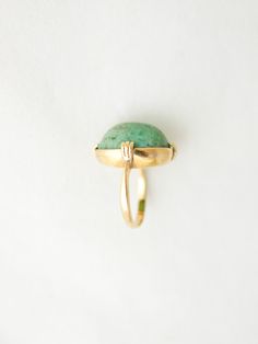 Natural, unpolished jade dome ring set in 18k gold band. Unusual & unmarked. Maker unknown. Antique estate find and likely 100+ years old based on the home and other antiques. Because this is a dome and sits fairly high there is room to fit up to 5.5 ring finger. Tests as 18k gold Size 5 Dome 3/4" x 1/2" Vintage Gold Domed Ring, Antique Turquoise Ring In Yellow Gold, Vintage 14k Gold Domed Dome Ring, Yellow Gold Domed Gemstone Ring, Vintage Domed Dome Ring As Gift, Vintage Dome Ring With Cabochon In 14k Gold, Vintage Dome Ring As A Gift, Vintage Gold Dome Ring With Oval Cabochon, Vintage Domed Cabochon Rings