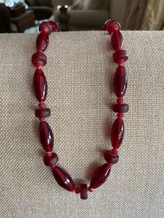 Czechoslovakia Glass Deep Red 20" Vintage Beaded Necklace Lovely made with 3 different shaped beads creating a lovely style Necklace! Metal ends and clasp  Light weighed around 2.3oz. Lovely piece to own! Thank You For Visiting :) ** I Ship Out Same Day **All questions encouraged and additional photographs will be sent upon request! Please ask all questions and thoroughly check each picture and description as ALL SALES ARE FINAL** Red Carnelian Beaded Necklace With Faceted Beads, Red Carnelian Faceted Beaded Necklaces, Red Carnelian Single Strand Necklace, Red Carnelian Necklace With Faceted Beads, Red Vintage Hand-strung Jewelry, Handmade Burgundy Necklaces With Round Beads, Red Carnelian Beaded Necklace Hand-strung, Red Carnelian Jewelry With Faceted Beads, Hand-strung Red Carnelian Beaded Necklaces