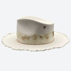 One of our best sellers, the Apollo is the perfect summer straw and a favorite with women and men. Its style is balanced with Valerias 'raw' edging and distressed details. The ultimate add to your summer style. All hats are created, shaped and detailed by Valeria Andino in her Studio. Hat Bar, Straw Fedora Hat, Doll Aesthetic, Straw Fedora, Head Pieces, Wide Brim Fedora, Doll Wardrobe, Crimp Beads, Hat Ideas