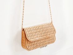 This straw clutch bag for women is a small crossbody purse for any occasion: holiday, evening, wedding, going out. Natural raffia bag will make you image complete. The straw bag is handmade using the technique of weaving on plastic canvas. It has a tight frame, keeps its shape well.  DETAILS:- thread is 100% raffia- length 18cm/7 in, height 11cm/4 in, width 5.5cm/2 in- removable chain handle: 118cm/46 in- color – beige- 100% silk lining (sewn by an invisible stitch manually) with inside pocket- Rectangular Straw Shoulder Bag For Evening, Elegant Summer Clutch Bag, Elegant Handmade Natural Clutch, Trendy Rectangular Evening Bag For Summer, Elegant Natural Color Clutch Evening Bag, Elegant Natural Color Evening Clutch Bag, Elegant Straw Crossbody Bag For Daily Use, Elegant Straw Crossbody Bag For Vacation, Elegant Crossbody Straw Bag For Daily Use