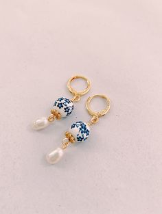 Dainty Blue Porcelain Pearl Gold Huggie Earrings Blue White | Etsy Blue Porcelain Jewelry, Gold And Blue Earrings, Artisan Blue Hoop Earrings As Gift, Handmade Blue Pearl Earrings For Gift, Traditional Blue Hoop Earrings For Gift, Handmade Small Hoop Pearl Earrings For Gifts, Blue And Gold Jewelry, Blue And White Jewelry, Small Hoop Earrings Gold