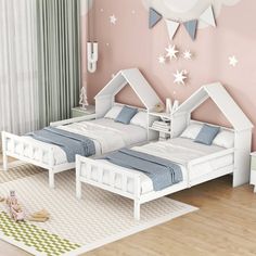 two white beds in a pink room with stars on the wall and curtains behind them