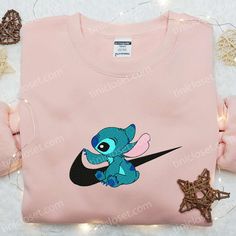 Stitch x Swoosh Embroidered Sweatshirt, Disney Characters Embroidered Hoodie, Best Gift Ideas for Family Welcome to the enchanting world of Tinicloset, where every thread tells a story and your wardrobe becomes a canvas for creativity! Our store is a delightful haven for those seeking custom embroidered apparel that fuses the charm of Disney with the... Family Gift Ideas, Embroidered Apparel, Gift Ideas For Family, Best Family Gifts, Personalized Photo Frames, Best Gift Ideas, Disney Lover, Embroidered Clothes, Embroidered Sweatshirt