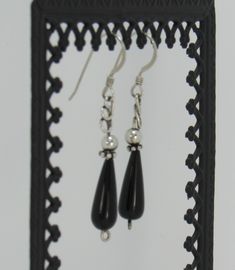 "BE22-Handmade Sterling Silver Earrings with Teardrop Black Onyx and SS Beads. Earrings hang down about 1 3/4\" and have a hand crafted design on top to make them unique. All of my pieces are one of a kind and made by me from start to finish. If you would like more information on my jewelry or me please go to my website at: www.denimanddiamondjewelry.com Thanks for looking! Feel free to contact me with any questions or more info on this piece. Patti" Teardrop Black Beaded Earrings As Gift, Teardrop Earrings With Black Beads For Gifts, Teardrop Black Beaded Earrings For Gift, Black Beaded Teardrop Earrings For Gift, Nickel Free Black Round Bead Earrings, Onyx Drop Earrings With Ear Wire, Artisan Dangle Earrings With Black Beads, Artisan Black Beaded Dangling Earrings, Black Artisan Earrings