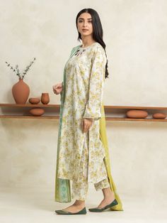 Brand: edenrobe Product: EWU24A1-29022-3PCollection: Allure Lawn Unstitched - Spring Summer CollectionFabric: Lawn DESIGN DETAILS: 3M Printed Lawn Shirt 2.5M Printed Lawn Dupatta 1.8M Dyed Trouser DISCLAIMER:* Lining, Laces, and Tassels are not included in unstitched variants.* Embellishment items in stitched outfits are subject to market availability.* The actual colors of the outfit may vary from the colors being displayed on your device. CARE INSTRUCTIONS: Extra Fabric Has Been Used For Shoot Original Color May Vary Slightly From The Picture Dry Clean Recommended Iron The Clothes At Moderate Temperature Do Not Use Bleach, Or Stain Removing Chemicals Damp Fabric Should Not Be Exposed To Sunlight edenrobe Allure Lawn Spring Summer Collection Authenticity Guaranteed – 100% Original Brand 3 Eid Floral Print Pista Green Salwar Kameez, Pista Green Floral Print Salwar Kameez For Eid, Pista Green Floral Salwar Kameez For Eid, Fitted Green Sets With Naqshi, Unstitched Pista Green Floral Print Salwar Kameez, Unstitched Pista Green Salwar Kameez With Floral Print, White Floral Print Sets In Cambric, White Floral Print Cambric Set, Fitted Pista Green Sets With Naqshi Details