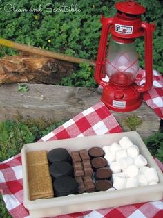 a red and white picnic table with marshmallows