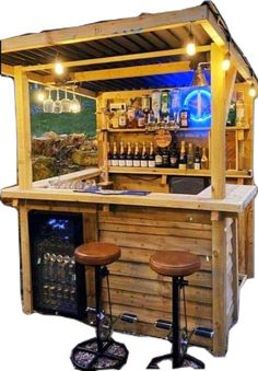 an outdoor bar with stools next to it