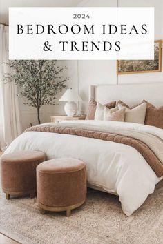 a bedroom with white and brown bedding, two stools and a tree in the corner