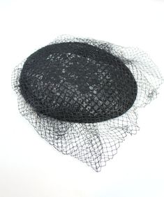 This is a lovely vintage pillbox hat from the 1950s.  The hat is made out of a black floral lace that is layered onto a stiff mesh backing to give the hat form.  The top of the hat is covered in a layer of tulle netting.  The hat has a curved oval shape. SIZING The hat measures approximately 7.5 inches long and 6 inches wide.  The hat is designed to rest slightly back on the crown of your head, so it should be a One Size Fits Most sort of hat.    CONDITION This hat is in very good vintage condit Pillbox Hat, Pill Boxes, Botanical Pattern, Floral Lace, Black Floral, Fascinator, Etsy Store, Caps Hats, Accessories Hats