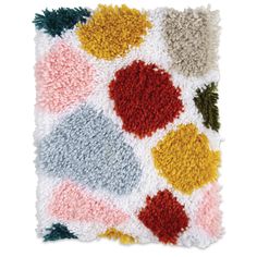 a multicolored rug with different shapes and sizes