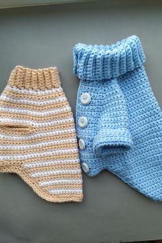 two crocheted baby pants sitting next to each other on top of a table