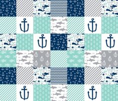 a blue and white checkered fabric with an anchor, whale, and fish on it