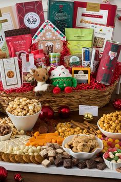 a table filled with lots of different types of snacks and treats in bowls on top of it