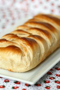 a long loaf of bread on a white plate