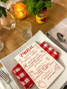 a place setting with red and white napkins