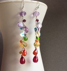 "I created these colorful dangles to celebrate being a jewelry designer for 12 years! Thank you to all of my wonderful customers for the support! These are made in sterling silver wire with amethyst, citrine, quartz, fire moonstone and more! The apprx. length is 2.5\" . Sterling silver wiring and French Ball earwires. Your earrings will be beautifully gift boxed. (To see VIDEO of these earrings please visit my instagram, @Sueanneshirzay August 12 2020 )" Handmade Colorful Jewelry For Birthday, Whimsical Rainbow Dangle Jewelry, Elegant Handmade Rainbow Earrings, Handmade Elegant Rainbow Earrings, Multicolor Jewelry With Matching Earrings For Birthday, Elegant Handmade Colorful Earrings, Colorful Whimsical Dangle Jewelry, Rainbow Multi-stone Jewelry For Party, Colorful Unique Dangle Jewelry