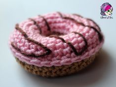 a crocheted donut sitting on top of a white table