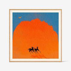 two horses are standing in front of an orange mountain and the moon is above them