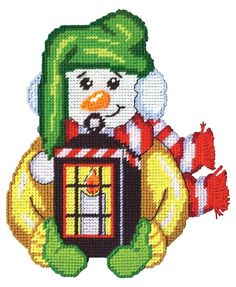 a snowman holding a bird in a cage with a green hat and scarf on