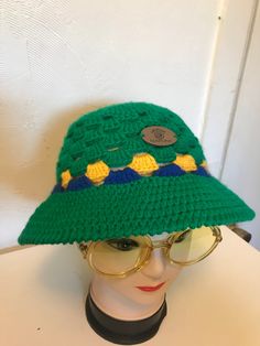 Hand made with 100% Acrylic yarn Adult Hat (S/M) 8 in. Length 24 in. Circumference Trendy Green Crochet Hat For The Beach, Trendy Green Crochet Hat For Beach, Trendy Green Crochet Beach Hat, Vintage Green Adjustable Hat, Retro One Size Bucket Hat For Beach, Retro One-size Bucket Hat For Beach, Retro Green Hat For Vacation, Vintage Crochet Cap Hat For Summer, Vintage Crochet Cap For Summer