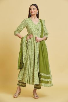 Green cotton angrakha with abstract print and gota embellished cutwork border. Paired with pant and dupatta.
Components: 3
Pattern: Printed, Embellished
Type Of Work: Abstract, gota
Neckline: V neck
Sleeve Type: Three quarter
Fabric: Anarkali and Pant: Cotton, Dupatta: Organza
Color: Green
Other Details: 
Side tassel detailing
Cutwork border
Sheer printed dupatta
Occasion: Sangeet - Aza Fashions Bollywood Style Chanderi Sharara With Block Print, Eid Block Print Mulmul Sharara, Eid Mulmul Sharara With Block Print, Cotton Fitted Anarkali Set With Sheer Dupatta, Eid Anarkali Kurta With Block Print, Anarkali Salwar Kameez With Block Print For Festivals, Green Cotton Sharara With Sheer Dupatta, Fitted Cotton Anarkali Set With Sheer Dupatta, Bollywood Style Block Print Salwar Kameez For Festivals